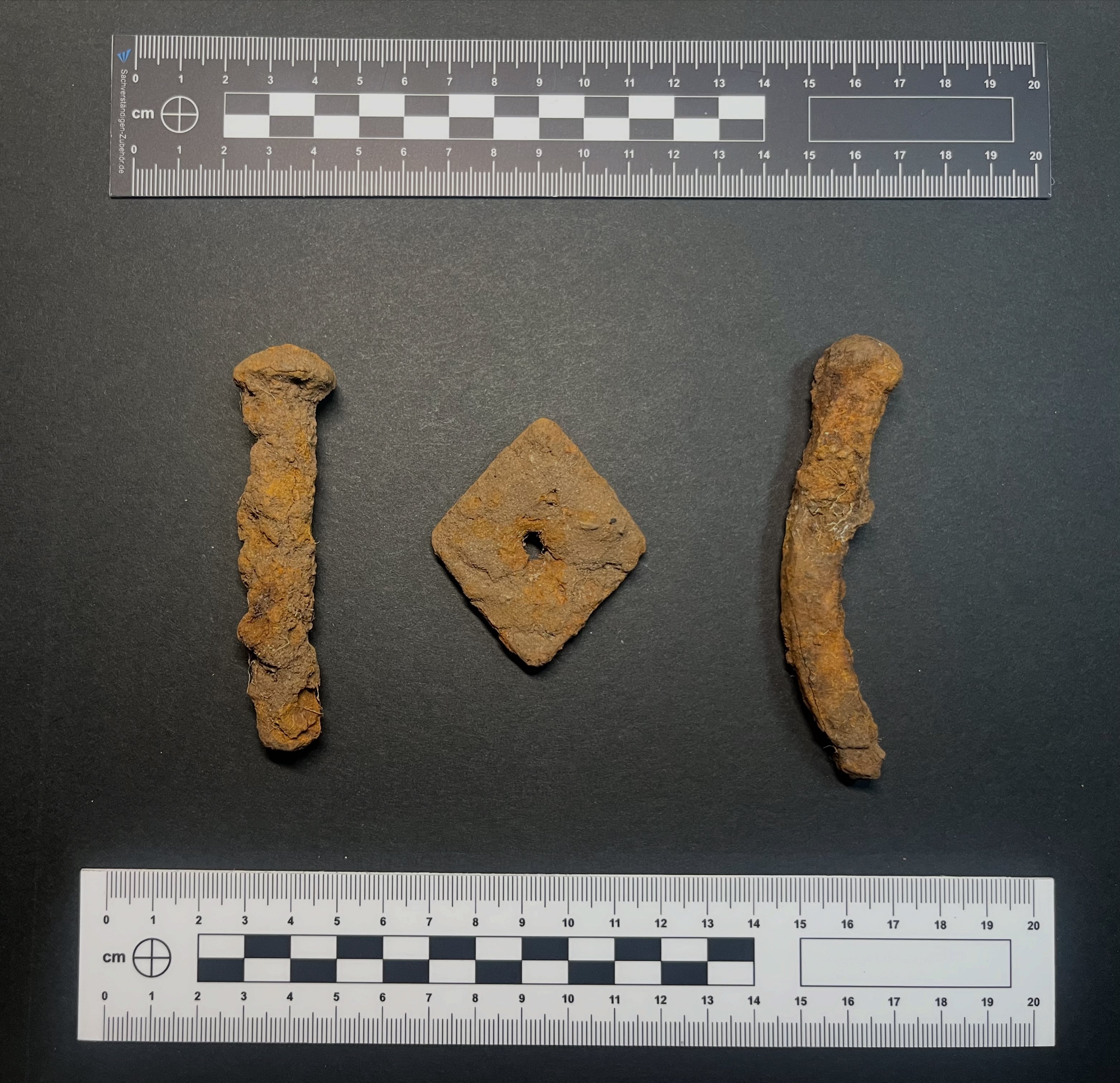 Metal boat rivets found nearby