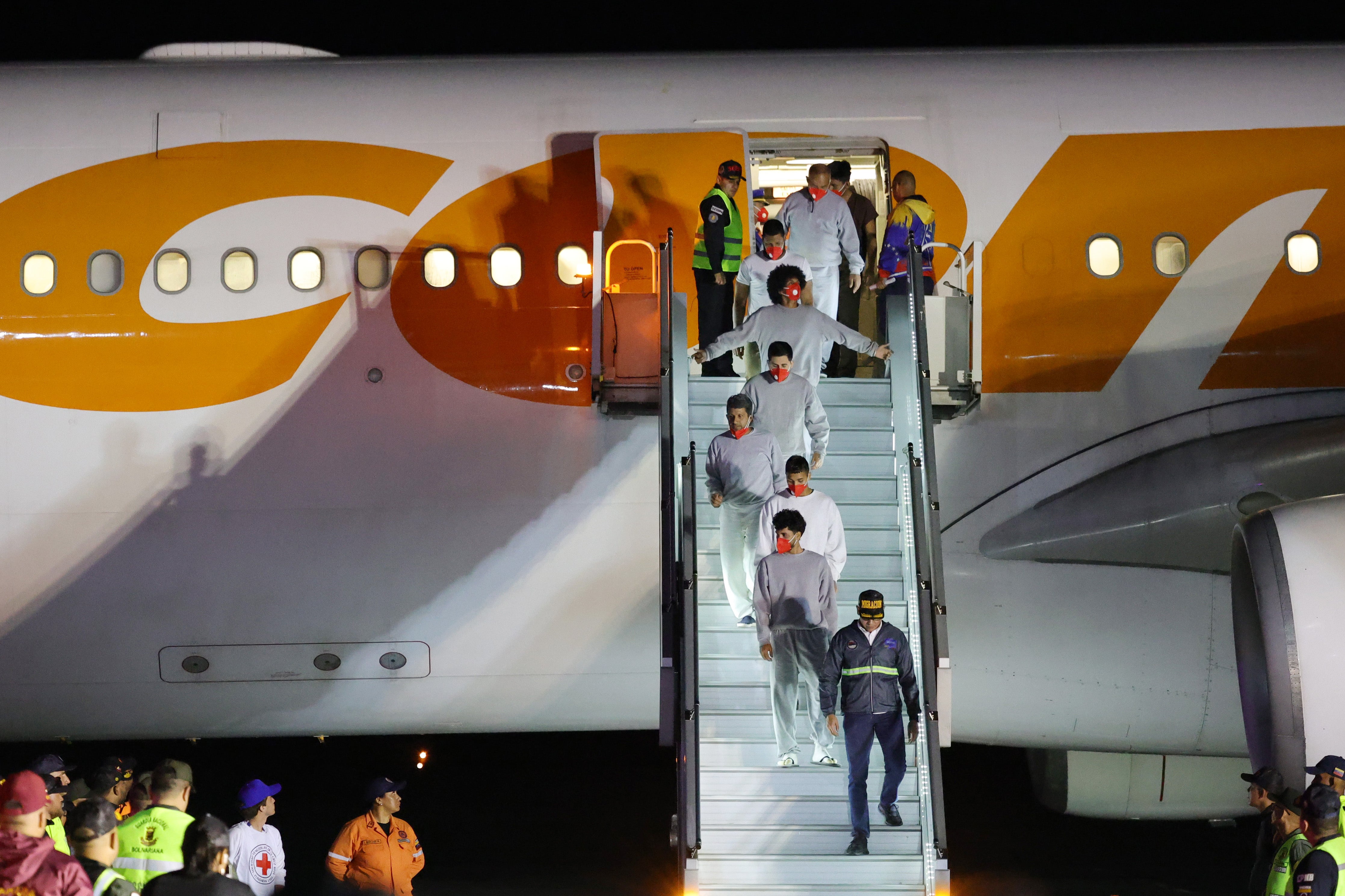 Venezuelan deported migrants disembark from a repatriation flight upon its arrival at Simon Bolivar International Airport on 20 February 2025 in La Guaira, Venezuela.
