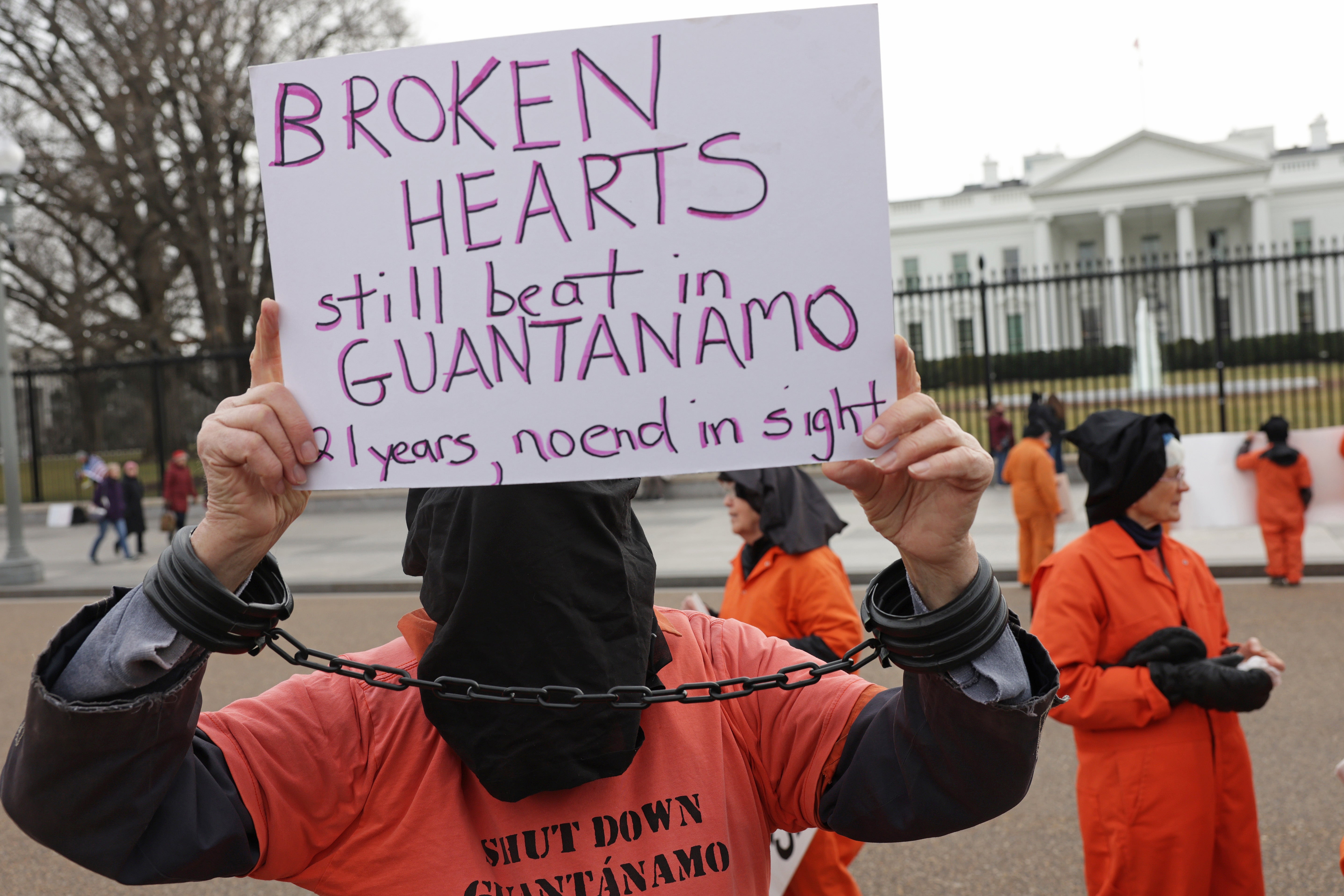 Activists representing the 35 men being held at the US detention facility in Guantanamo Bay, Cuba, participate in a protest in front of the White House on 11 January 2023.