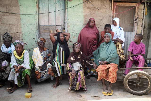 <p>Survivors gather on the third day of Islamic prayers for one of the victims of an extremist attack, in Kaiama, Nigeria.</p>