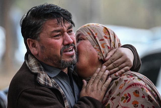 <p>People mourn the death of their relative in a suicide bombing at a Shiite mosque, outside a hospital in Islamabad</p>