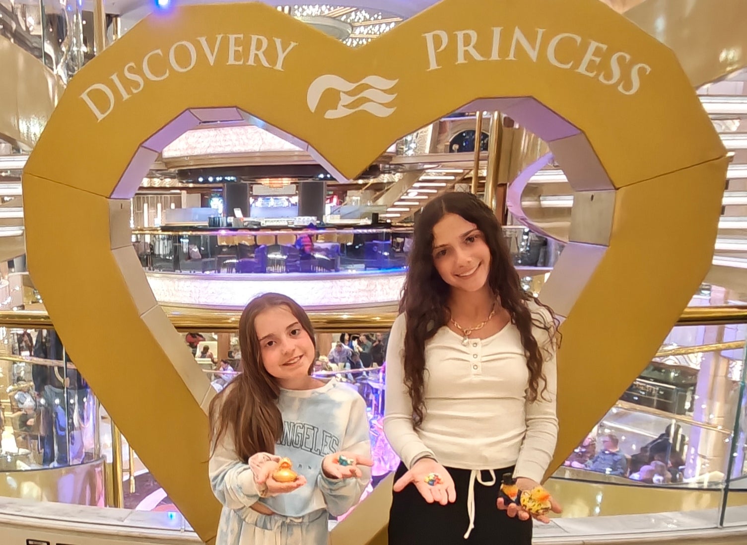 Amelie and Isabelle Shoffman with their cruise duck collection aboard Discovery Princess