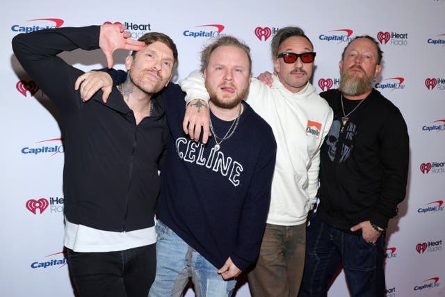 <p>Shinedown, consisting of Brent Smith, Zach Myers, Eric Bass and Barry Kerch, originally faced backlash from fans for their participation in the music festival</p>