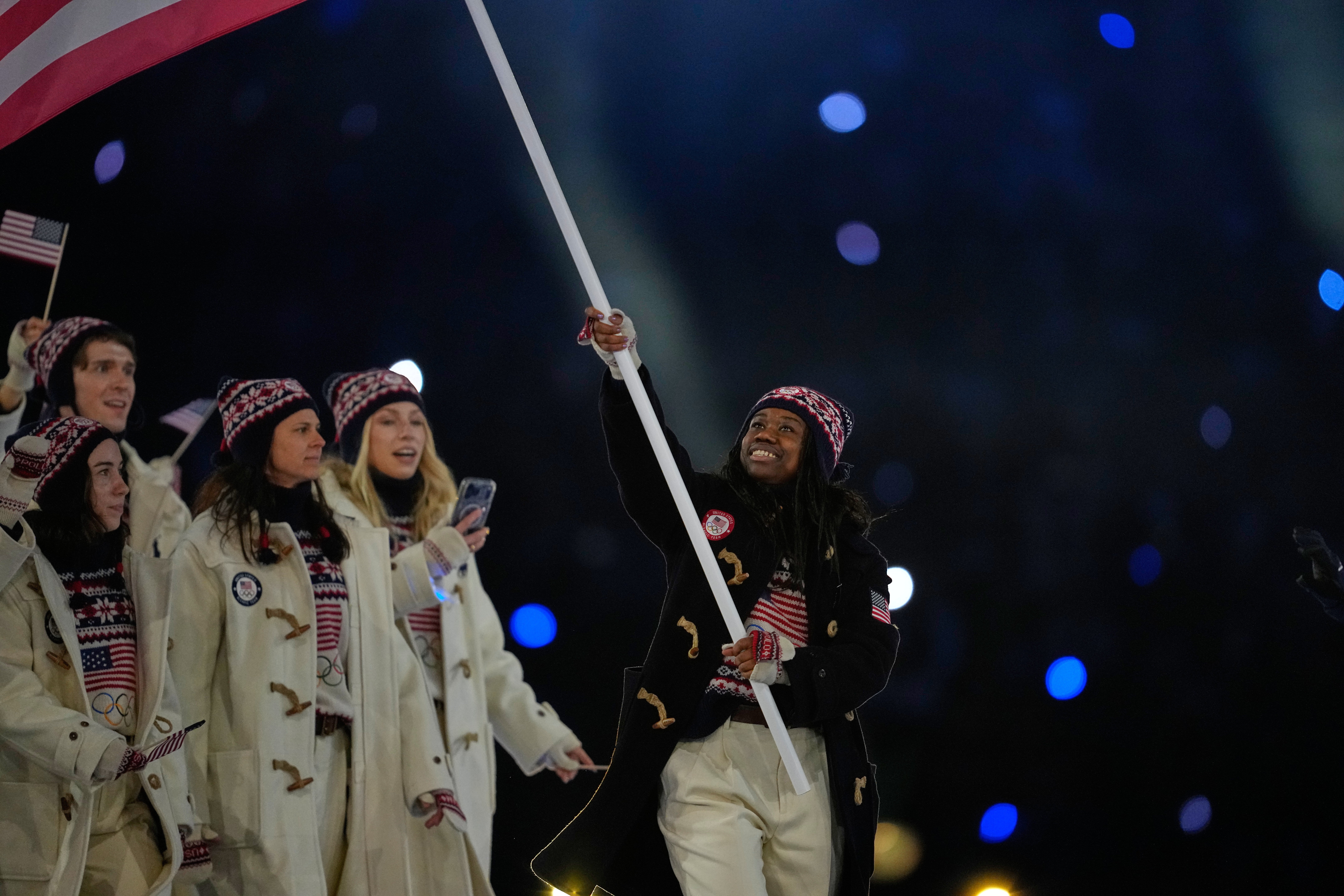 US flagbearer Erin Jackson leads the American team into the San Siro