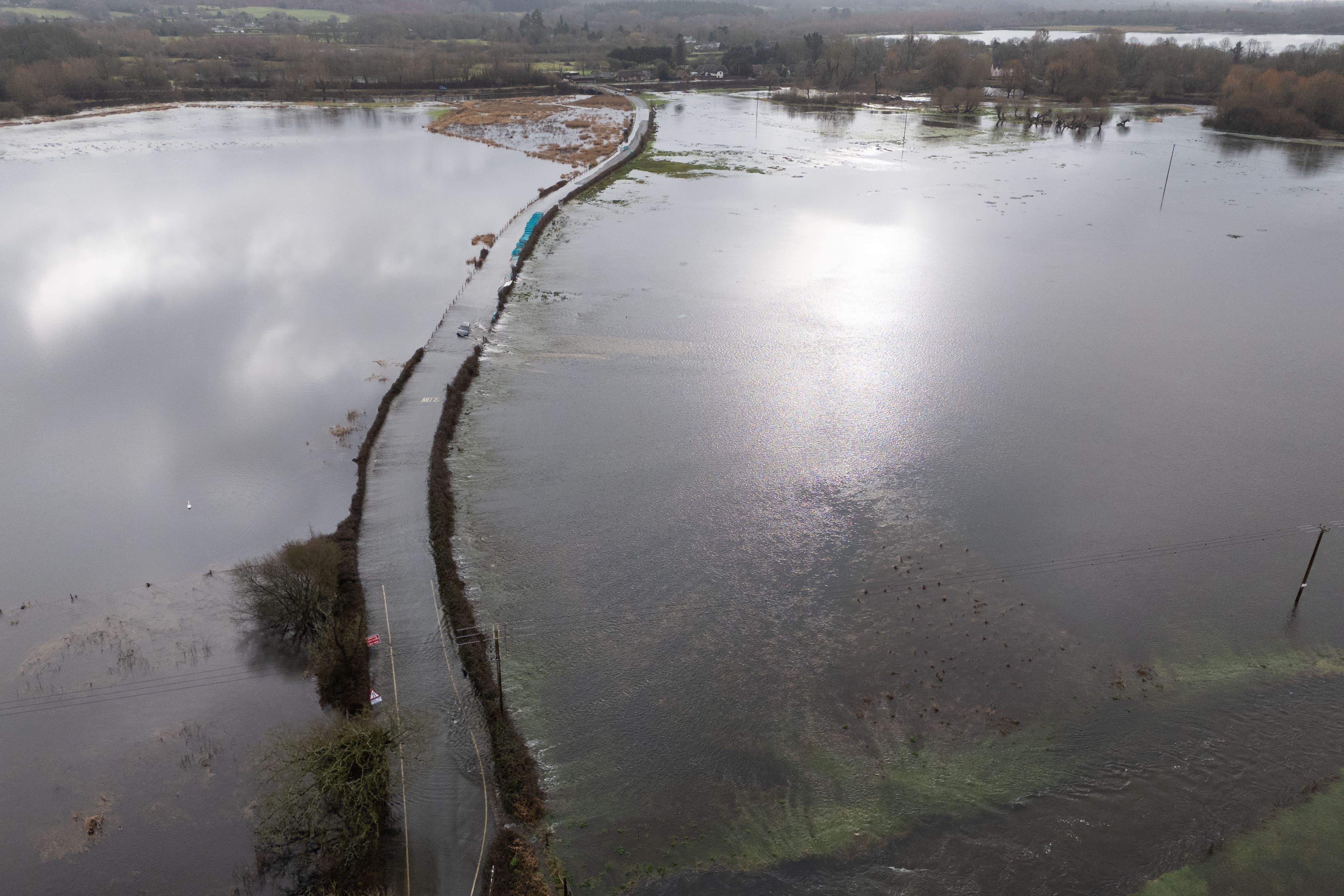 Flood water covers a road near Harbridge, Hampshire