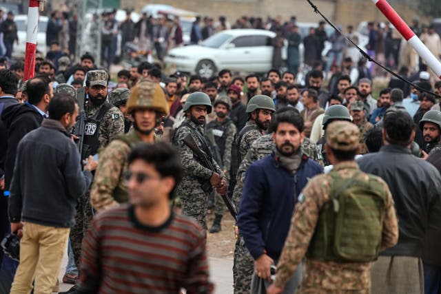 <p>Pakistani paramilitary soldiers control a crowd close to the site of a bomb explosion at a Shiite mosque, in Islamabad, Pakistan, Friday, 6 Feb 2026</p>