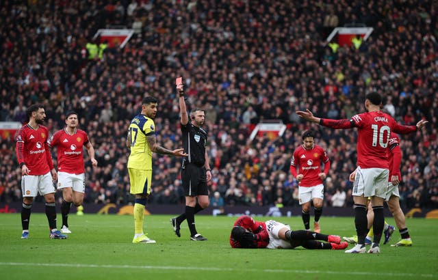 <p>Cristian Romero was sent off against Man United</p>
