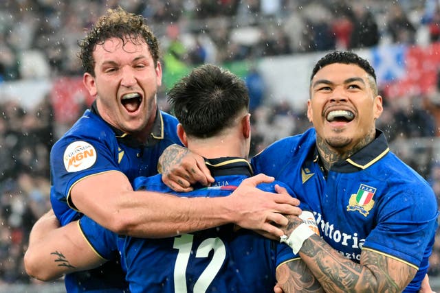 <p>Italy’s Tommaso Menoncello is congratulated by teammates after scoring a try during the Six Nations international rugby union match between Italy and Scotland at the Stadio Olimpico, in Rome (Photo by Alberto Pizzoli/AFP/Getty Images)</p>