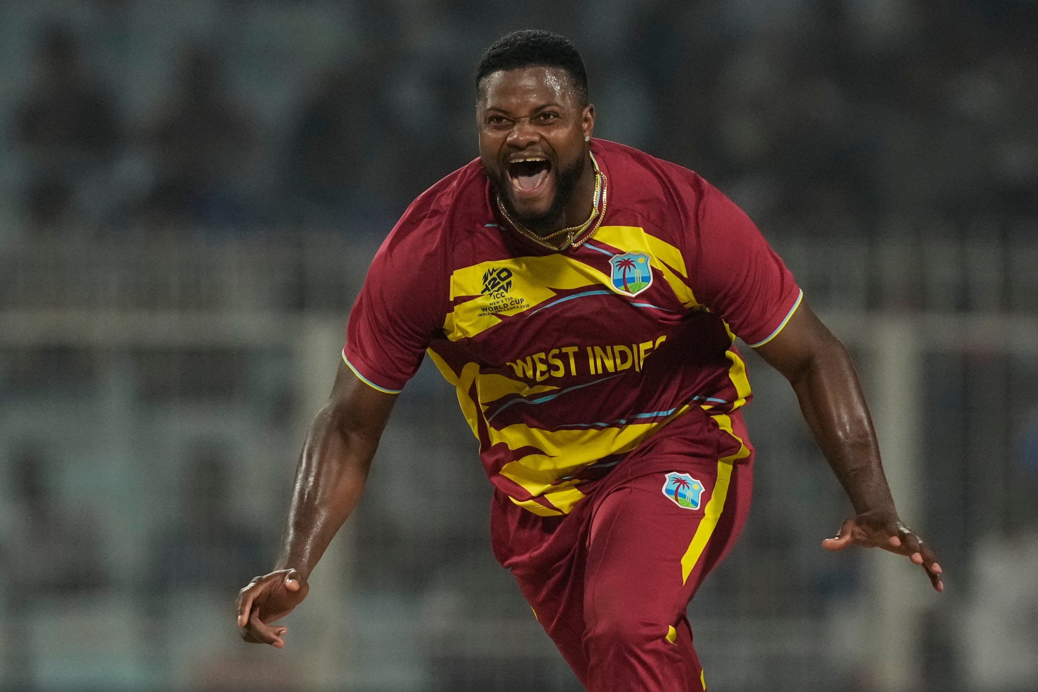 West Indies' Romario Shepherd celebrates the wicket of Scotland's Safyaan Sharif during the T20 World Cup cricket match between Scotland and West Indies in Kolkata, India. (AP Photo/Bikas Das)