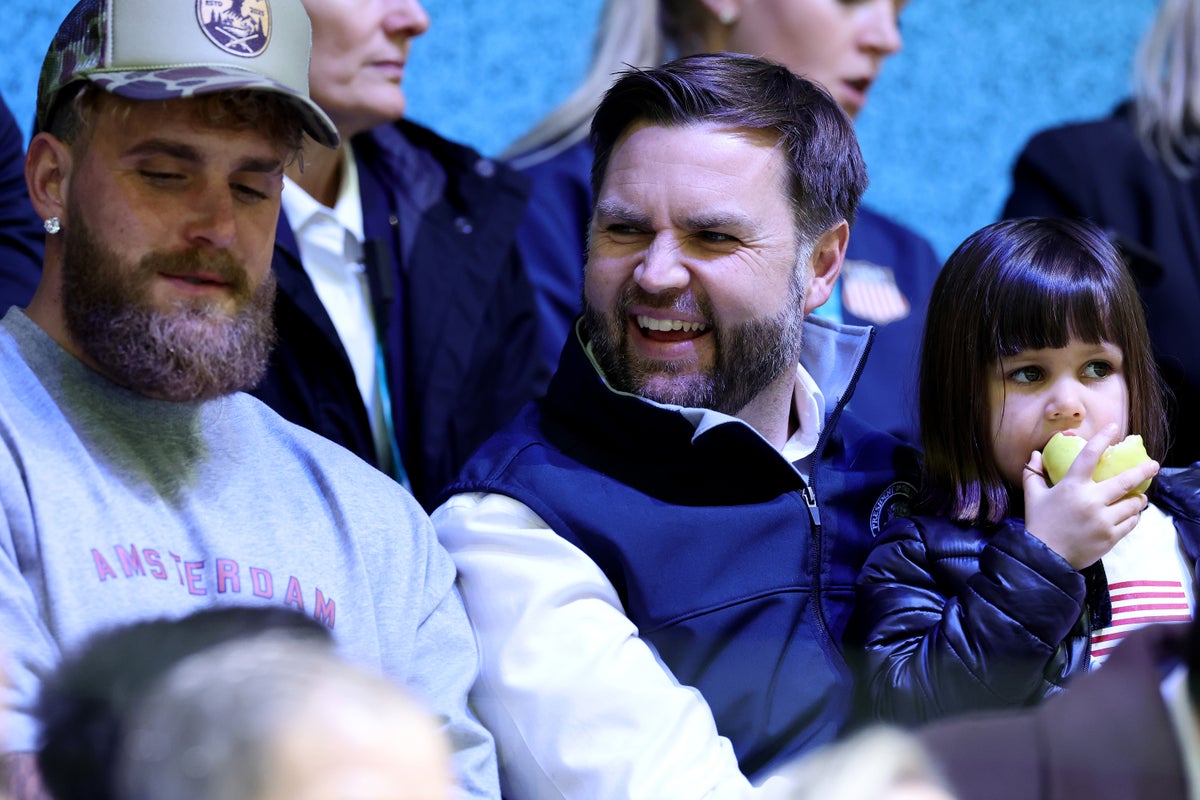 JD Vance and Jake Paul laugh and cheer as they watch US women’s hockey game at Winter Olympics