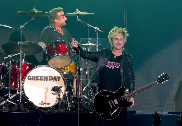 <p>Tre Cool and Billie Joe Armstrong of Green Day perform onstage</p>