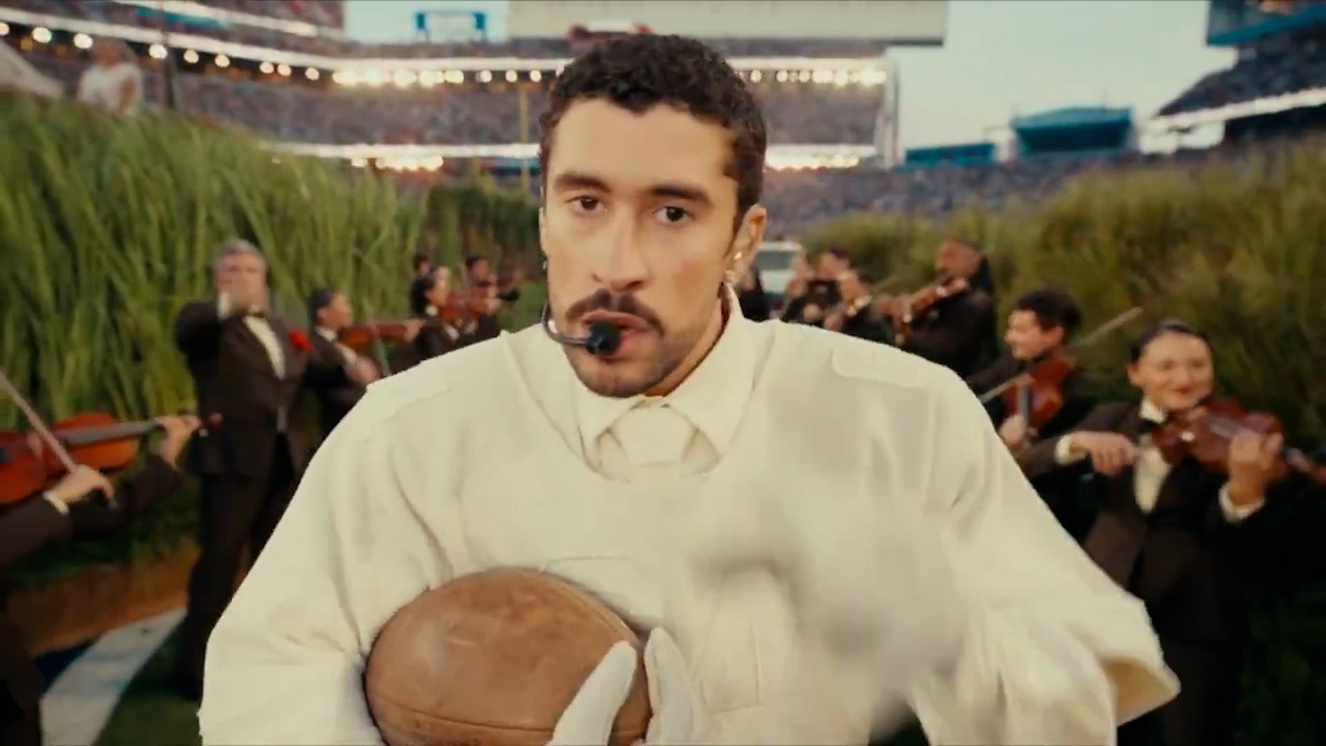 Bad Bunny held a football emblazoned with the message, ‘Together, we are America’