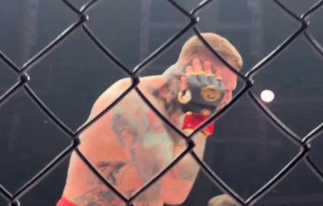 MMA fighter Vaclav Mikulasek clutches his ear after being bitten by Pavol Vasko