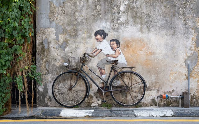 <p>Children On A Bicycle by Lithuanian artist Ernest Zacharevic</p>