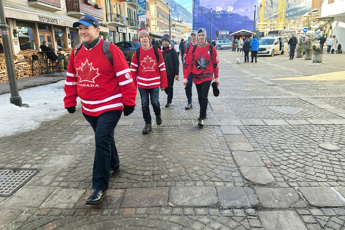 Olympic fans shed winter coats as climate change raises temperatures in Cortina