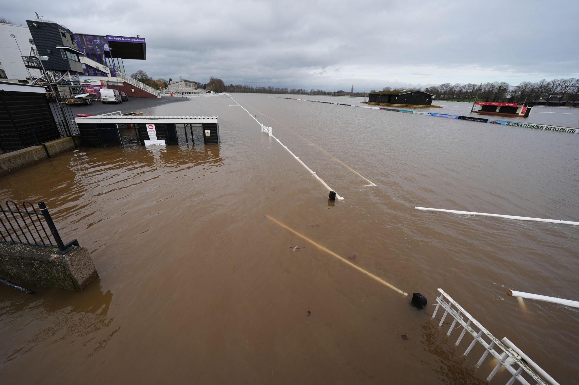 Floodwater covers the track at Worcester racecourse