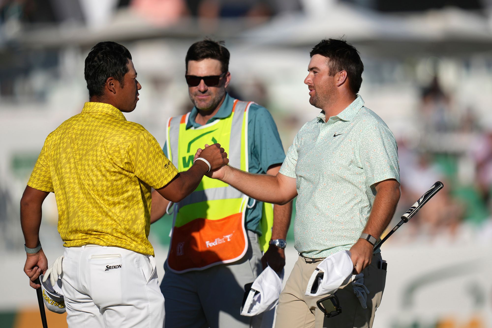 Chris Gotterup, right, shakes hands with Hideki Matsuyama