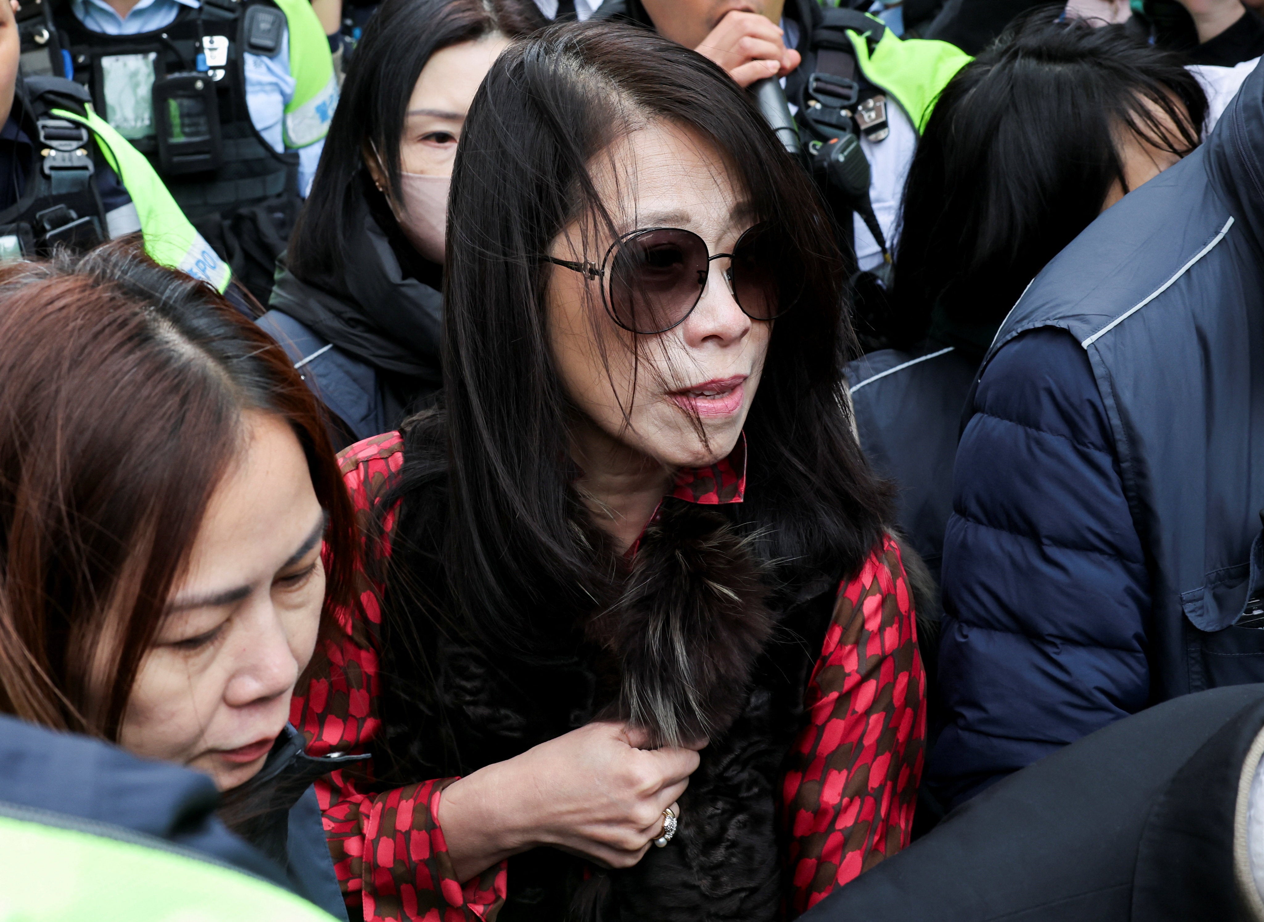 Teresa Lai, wife of Jimmy Lai, leaves West Kowloon Magistrates' Courts building after Jimmy Lai, founder of the now-defunct pro-democracy newspaper Apple Daily, was sentenced a total of 20 years in jail on three charges comprising two counts of conspiracy to collude with foreign forces and one count of publishing seditious materials, in Hong Kong, China