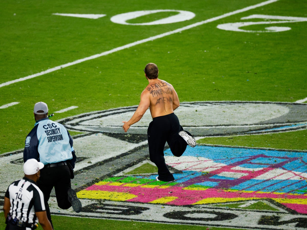 Streaker brings Super Bowl rout to a halt with cryptic crypto message  scrawled on his bare back | The Independent