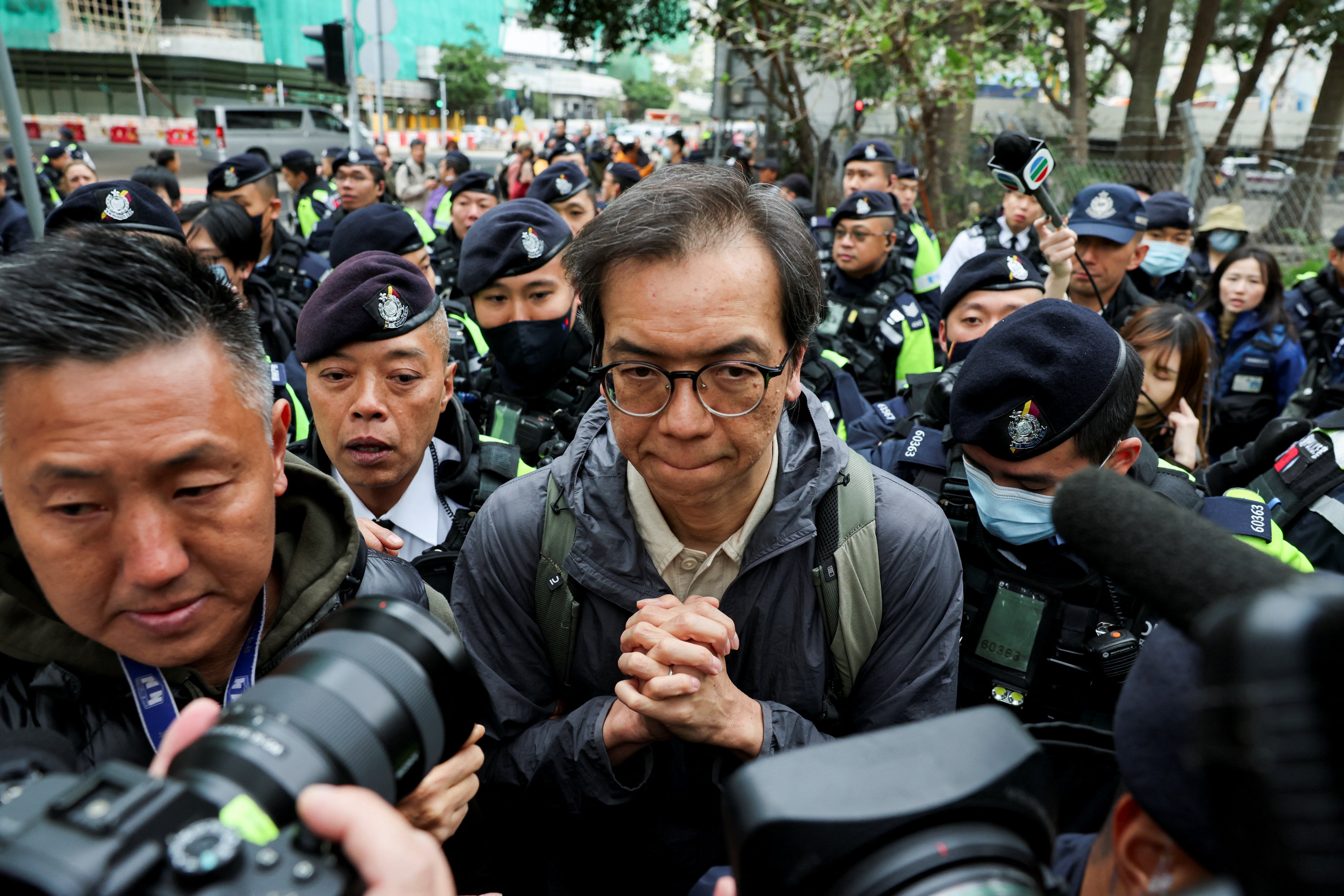 Chung Pui-kuen, former chief editor of the Stand News, leaves West Kowloon Magistrates' Courts building after Jimmy Lai, founder of the now-defunct pro-democracy newspaper Apple Daily, was sentenced a total of 20 years in jail on three charges comprising two counts of conspiracy to collude with foreign forces and one count of publishing seditious materials, in Hong Kong, China
