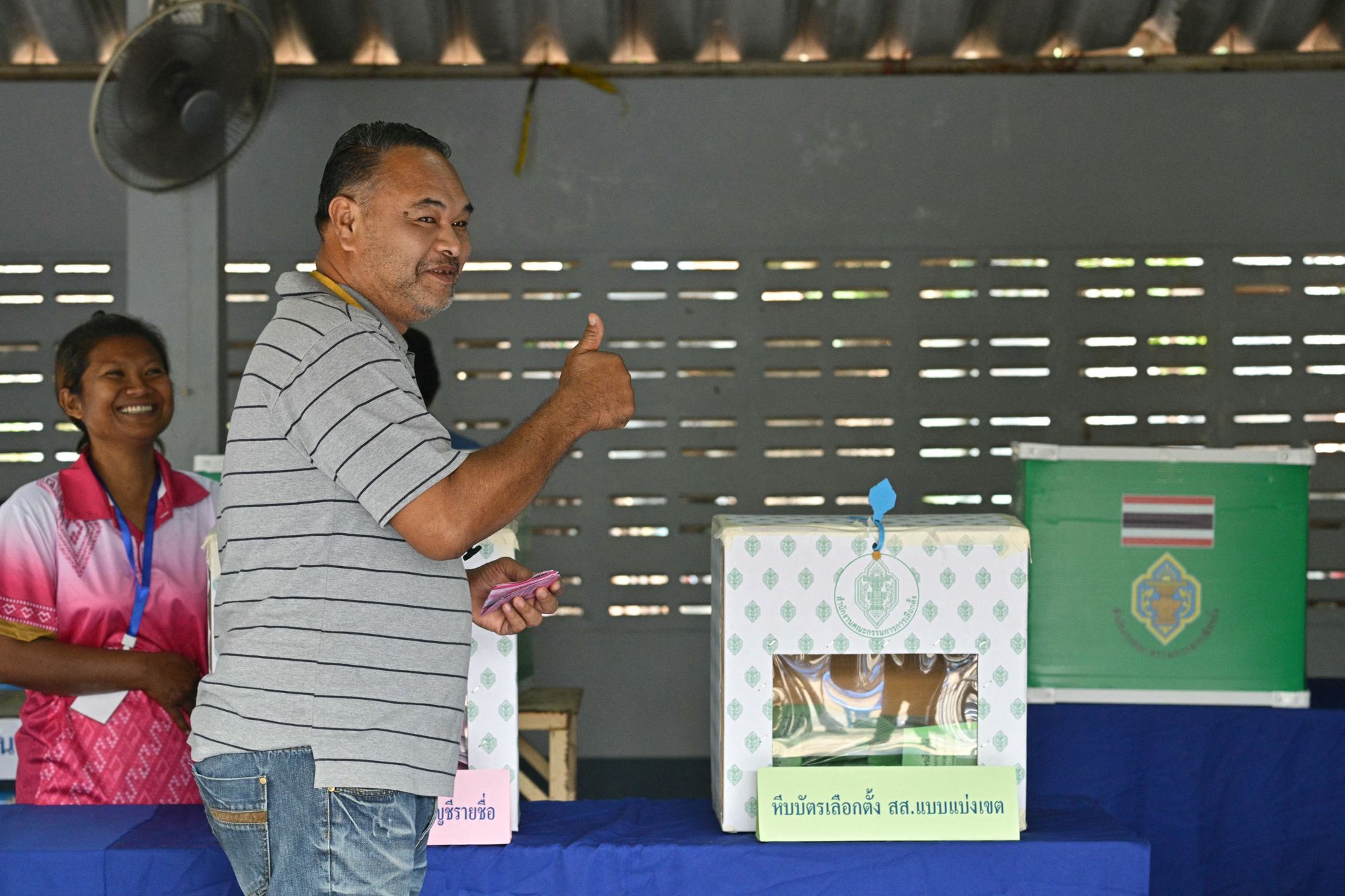 A voter gestures after casting his ballot in Thailand's general election in Buriram on 8 February 2026