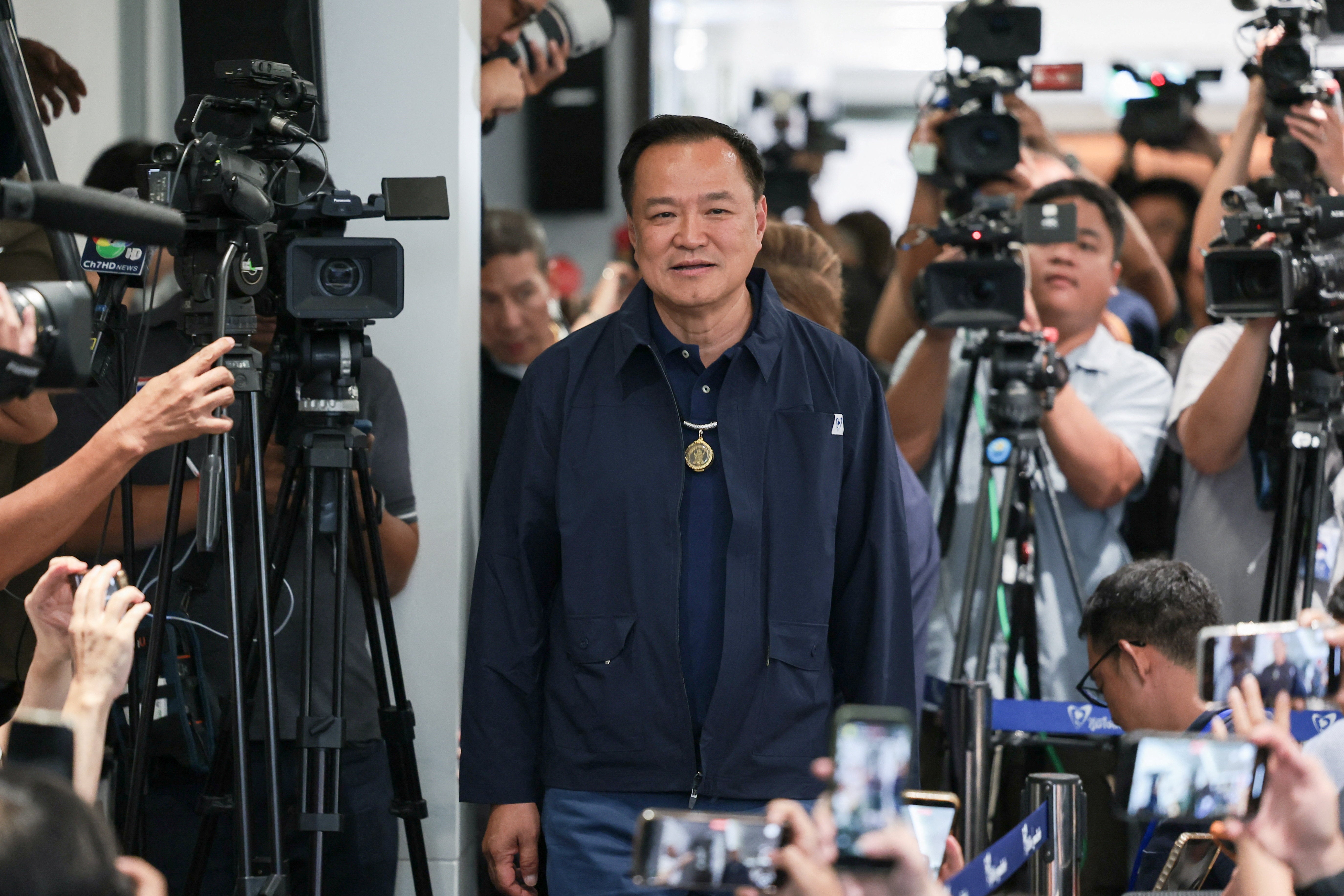 Thailand's caretaker prime minister Anutin Charnvirakul, Bhumjaithai Party leader and prime ministerial candidate, arrives for a press conference at the party headquarters on the day of the general election, in Bangkok, Thailand, 8 February 2026
