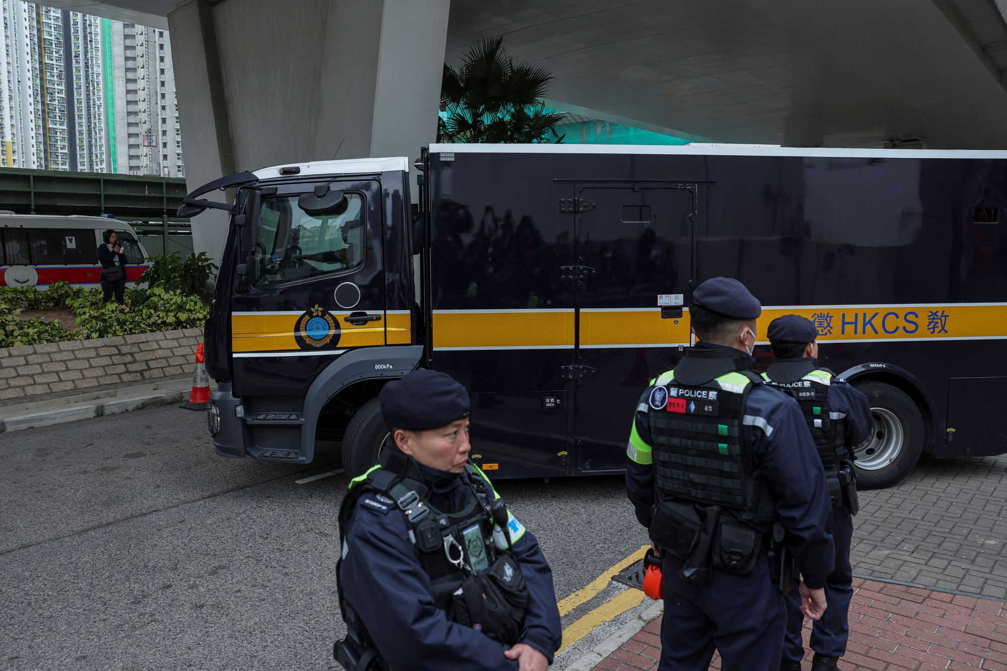 A prison van believed to be carrying Jimmy Lai, founder of the now-defunct pro-democracy newspaper Apple Daily, leaves the West Kowloon Magistrates' Courts building following sentencing in his national security collusion trial
