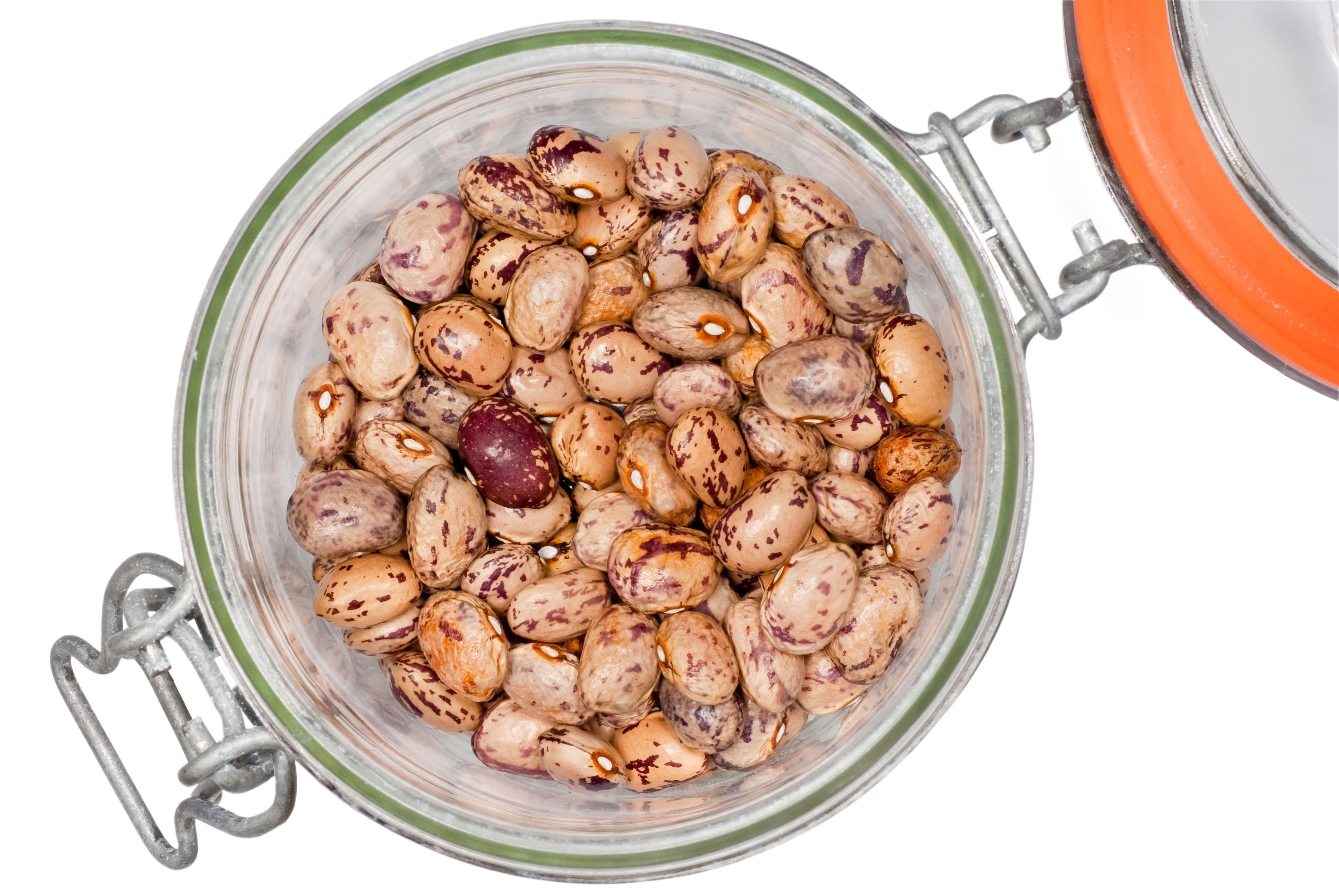 Dried borlotti beans in a glass jar
