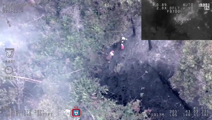 Watch as woman stuck in middle of bushfire is airlifted to safety