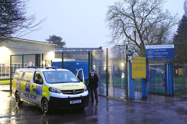 <p>Police at the scene at Kingsbury High School, north west London, after two pupils were stabbed</p>