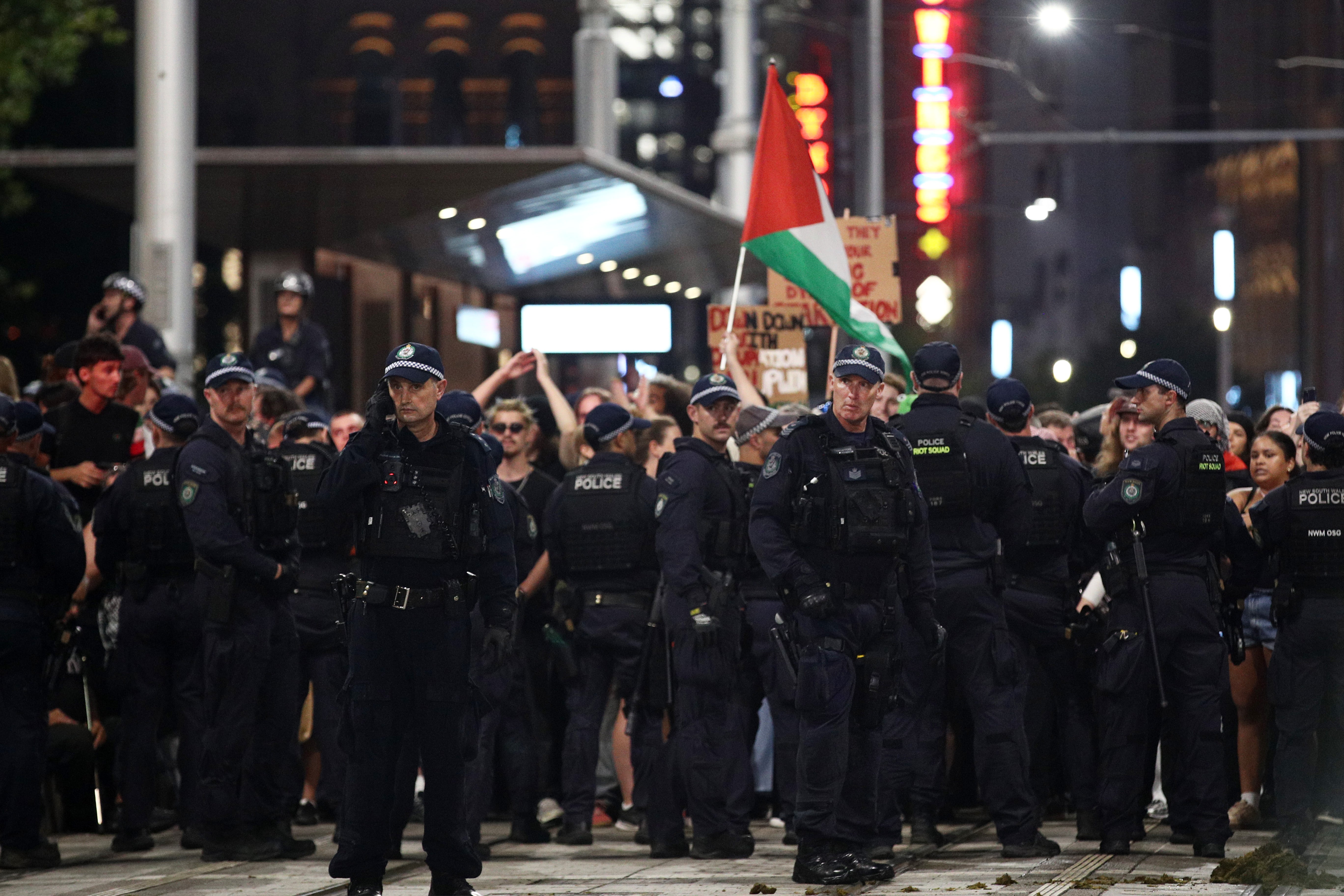 NSW Police surround protesters on George Street during a rally against the visit of Israel's President Isaac Herzog on 9 February 2026 in Sydney