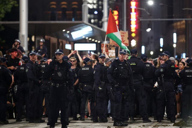 <p>NSW Police surround protesters on George Street during a rally against the visit of Israel's President Isaac Herzog on 9 February 2026 in Sydney</p>