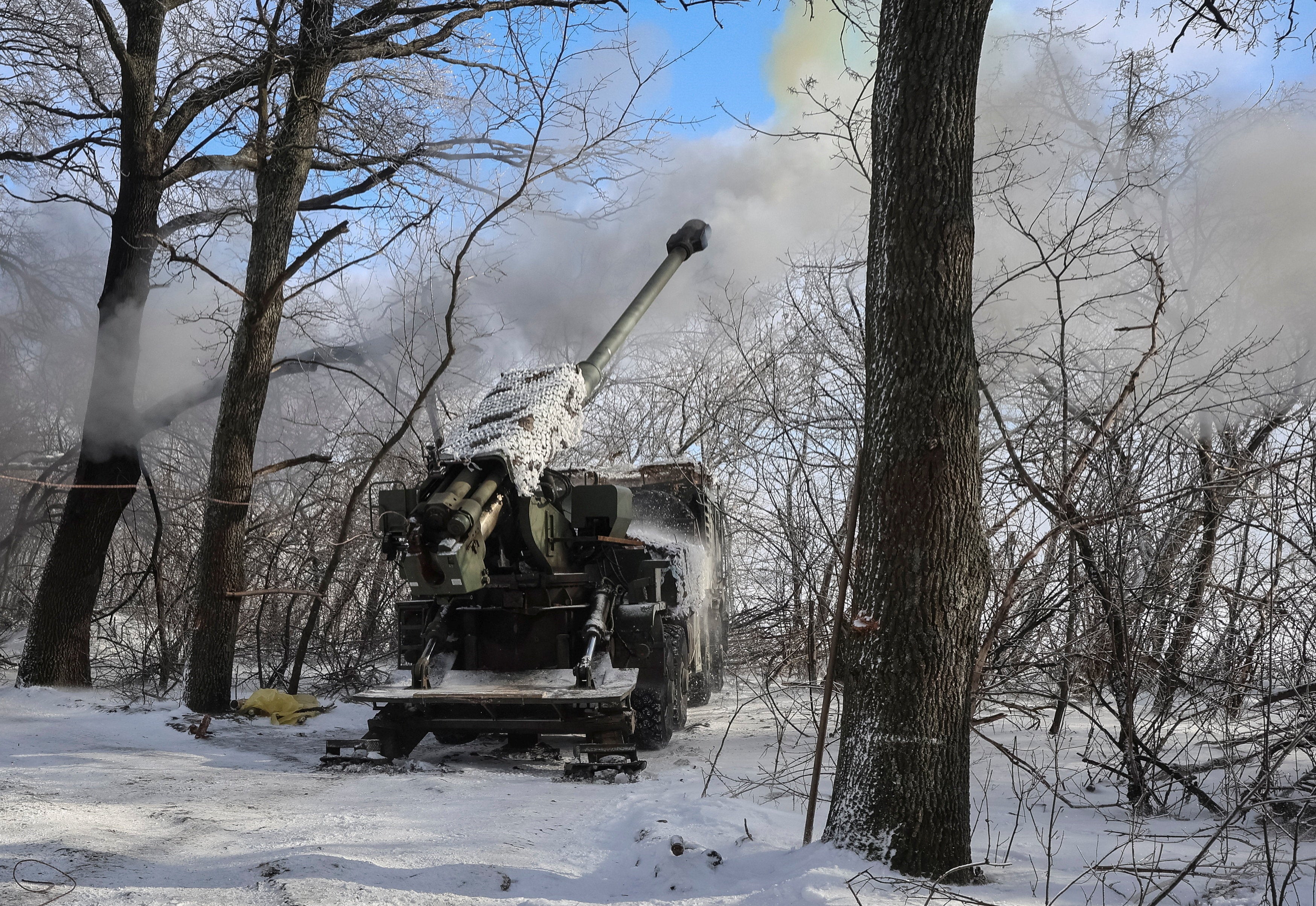Service members of the 48th Separate Artillery Brigade of the Ukrainian Armed Forces fire a 2S22 Bohdana self-propelled howitzer towards Russian troops near a front line