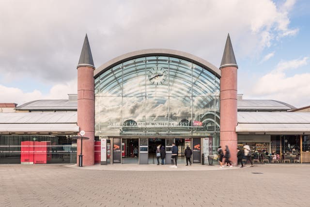 <p>Is this Paris? Passengers leaving the Ouigo express train from the south at Marne-la-Vallée station, some way east of the French capital </p>
