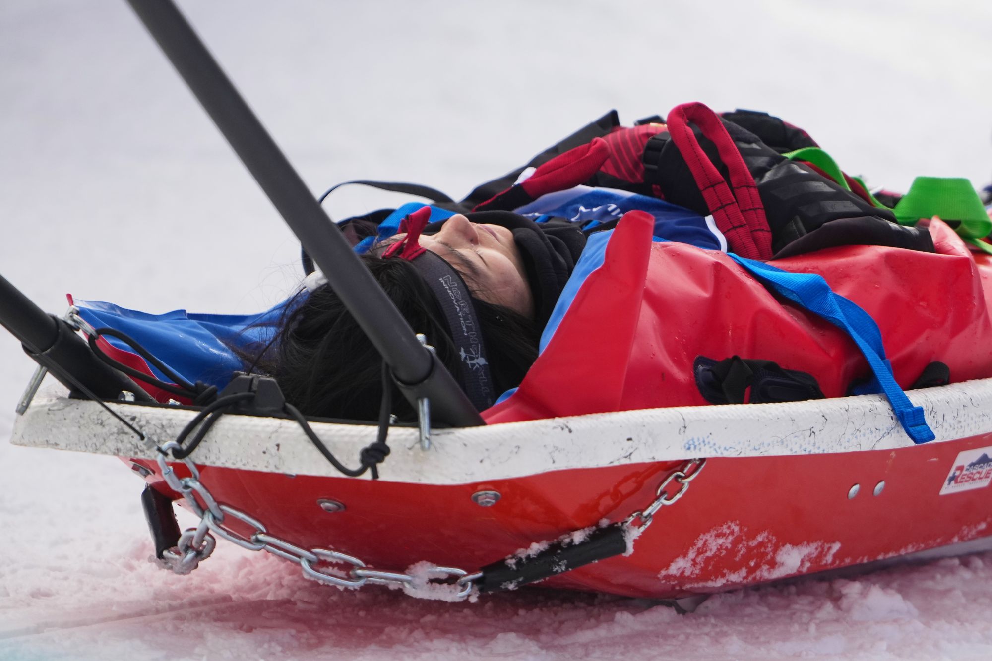 China's Liu Jiayu is stretchered off after crashing during the women's snowboarding halfpipe qualifications at the 2026 Winter Olympics