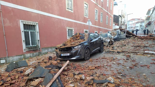 <p>Cars are seen damaged after a building's roof collapsed on them during the passage of storm Kristin in Figueira da Foz, Portugal</p>