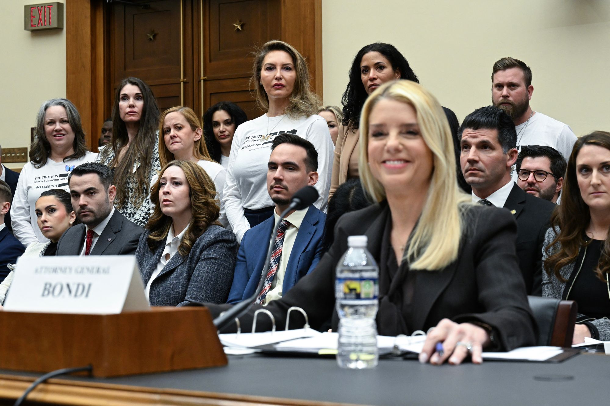Victims of convicted sex offender Jeffrey Epstein react as US Attorney General Pam Bondi testifies before a House Judiciary Committee hearing on "Oversight of the Department of Justice" on Capitol Hill in Washington, DC, on February 11, 2026