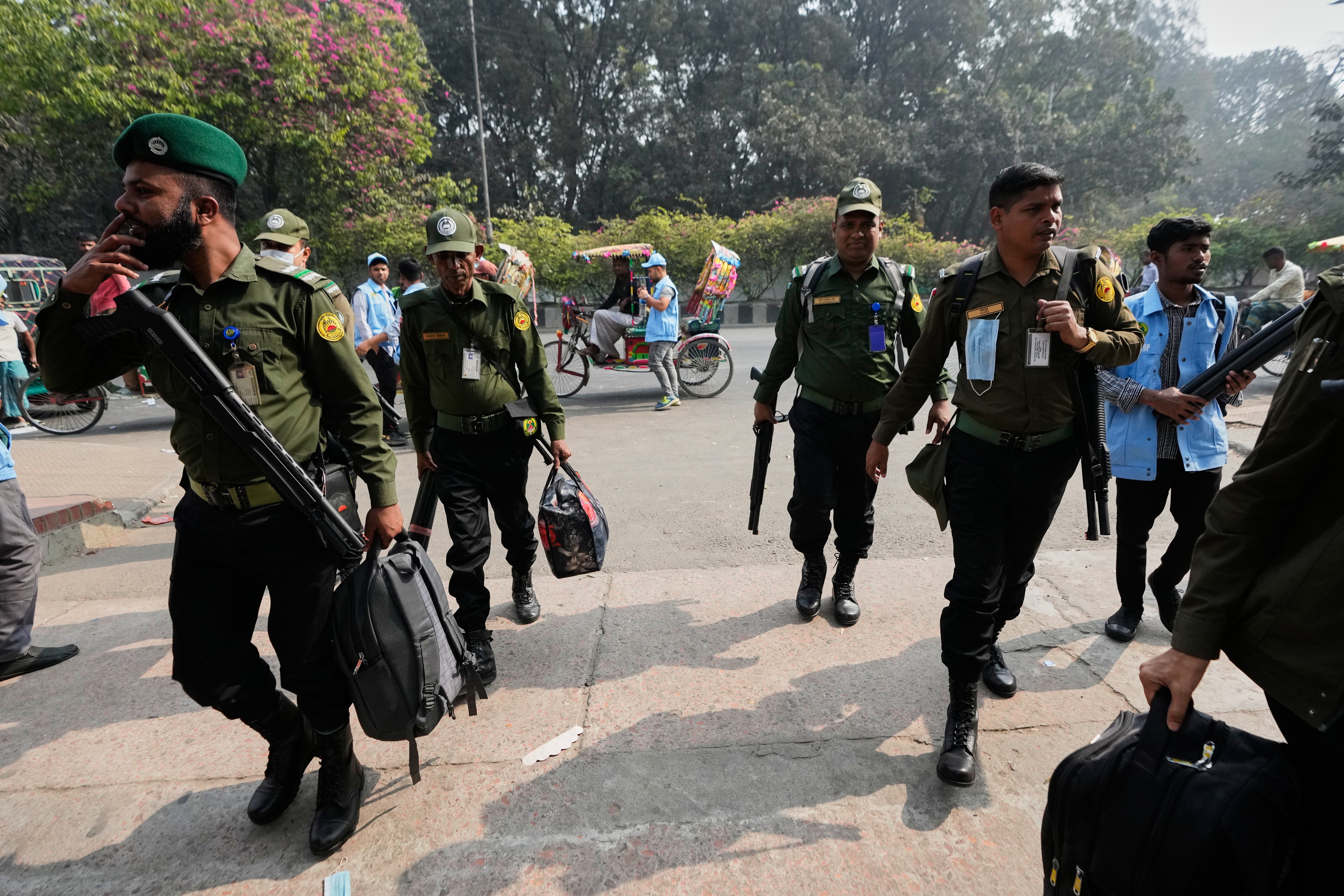 Security personnel arrive to collect ballot boxes and voting materials at a distribution centre ahead of Thursday's national parliamentary election, in Dhaka, Bangladesh, Wednesday, 11 Feb 2026