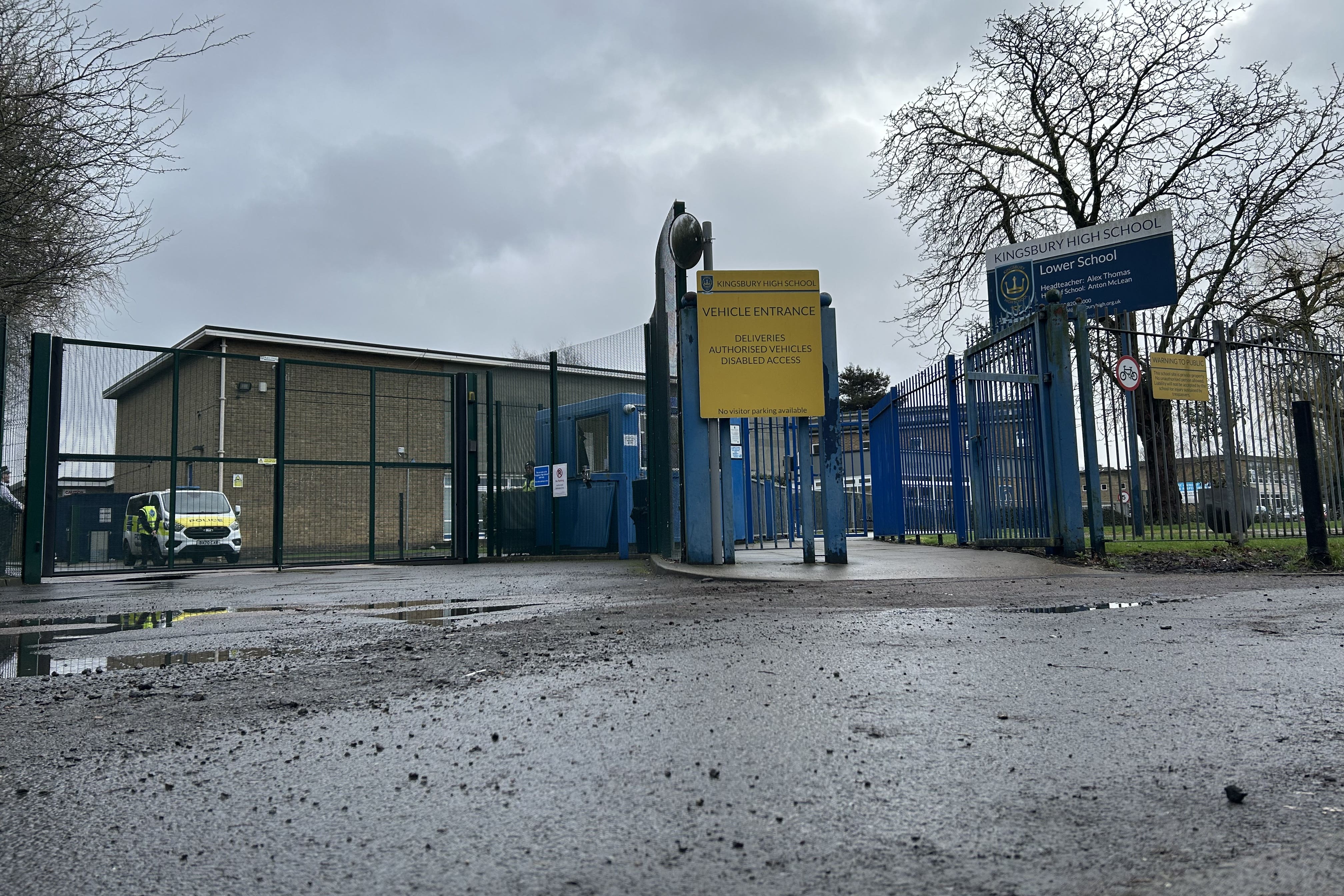 Police officers at the entrance to Kingsbury High School (Oscar Rihil/PA)