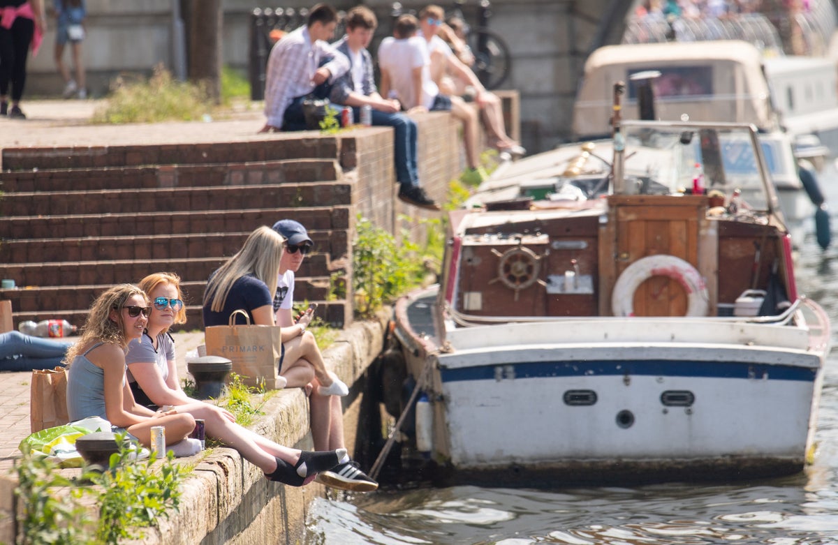 People enjoying warm weather in city