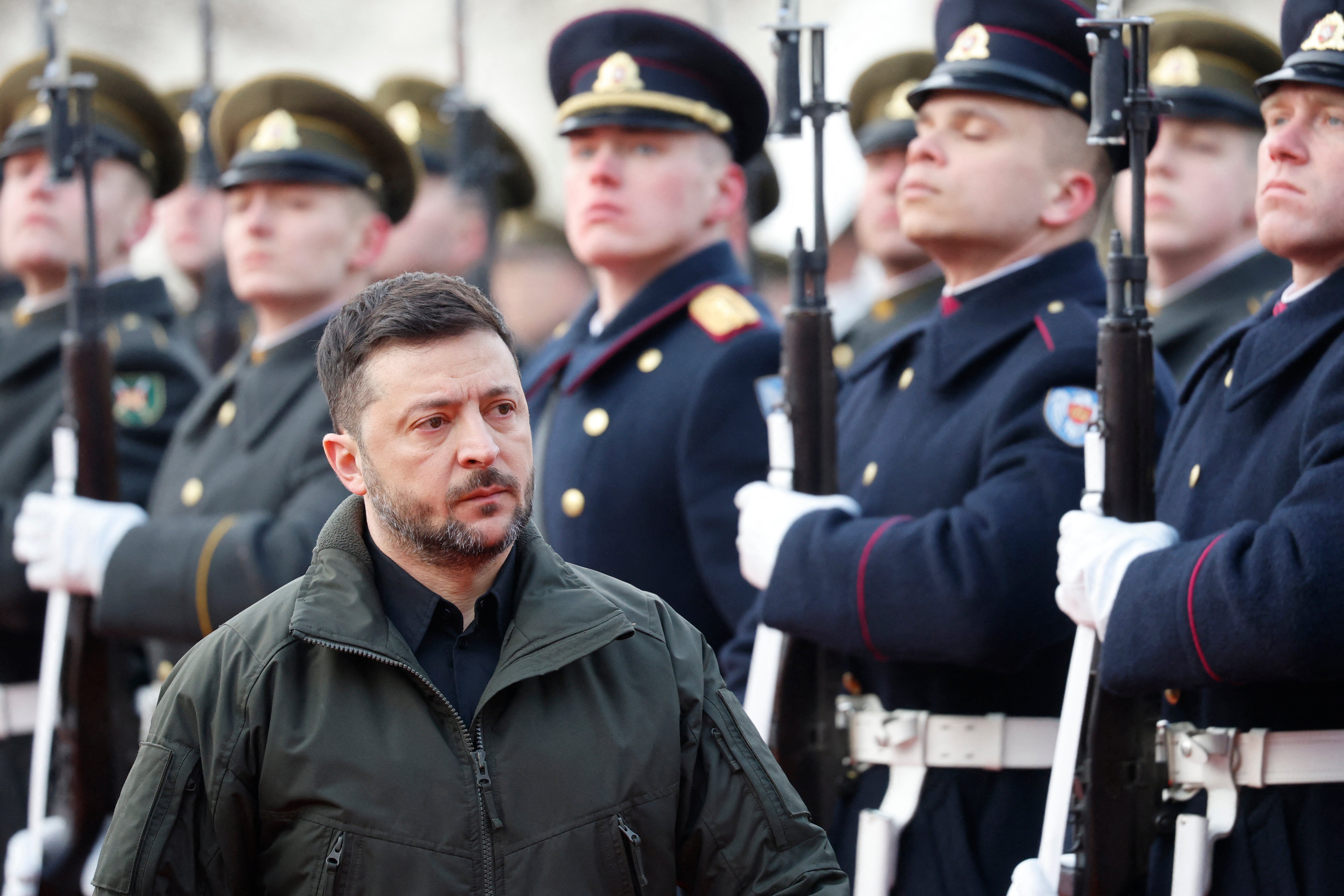 Ukraine's president Volodymyr Zelensky reviews the military honour guard with Lithuania's President during a welcoming ceremony in Vilnius