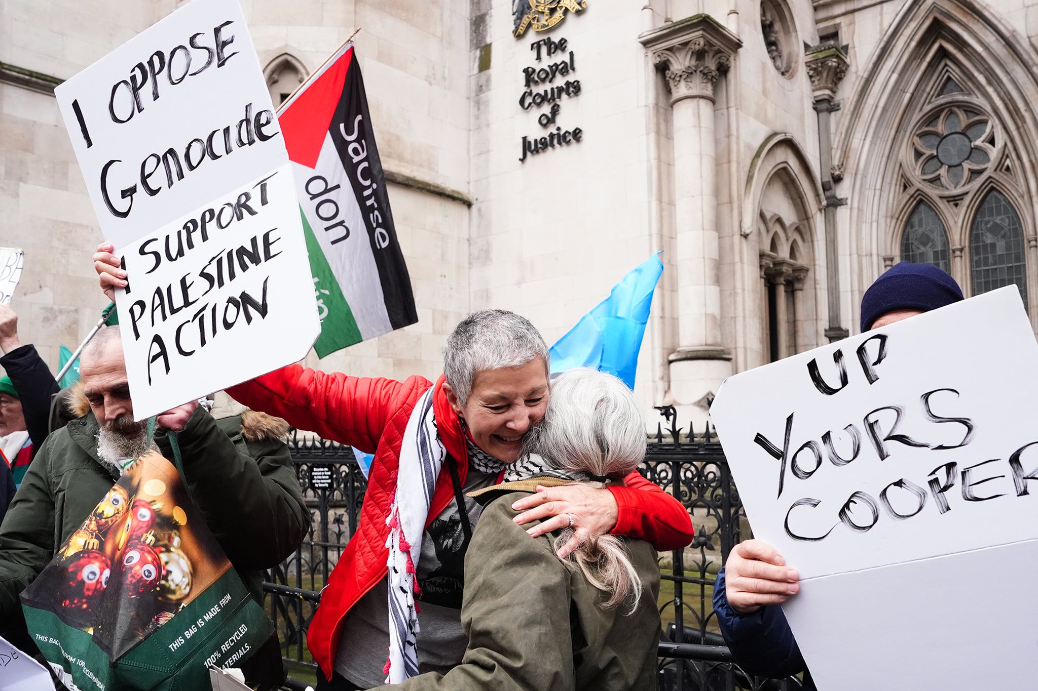 Protesters celebrate outside the High Court, central London, where Dame Victoria Sharp, Mr Justice Swift and Mrs Justice Steyn have ruled in favour of Palestine Action's co-founder Huda Ammori's challenge over the ban of the organisation as a terror group.