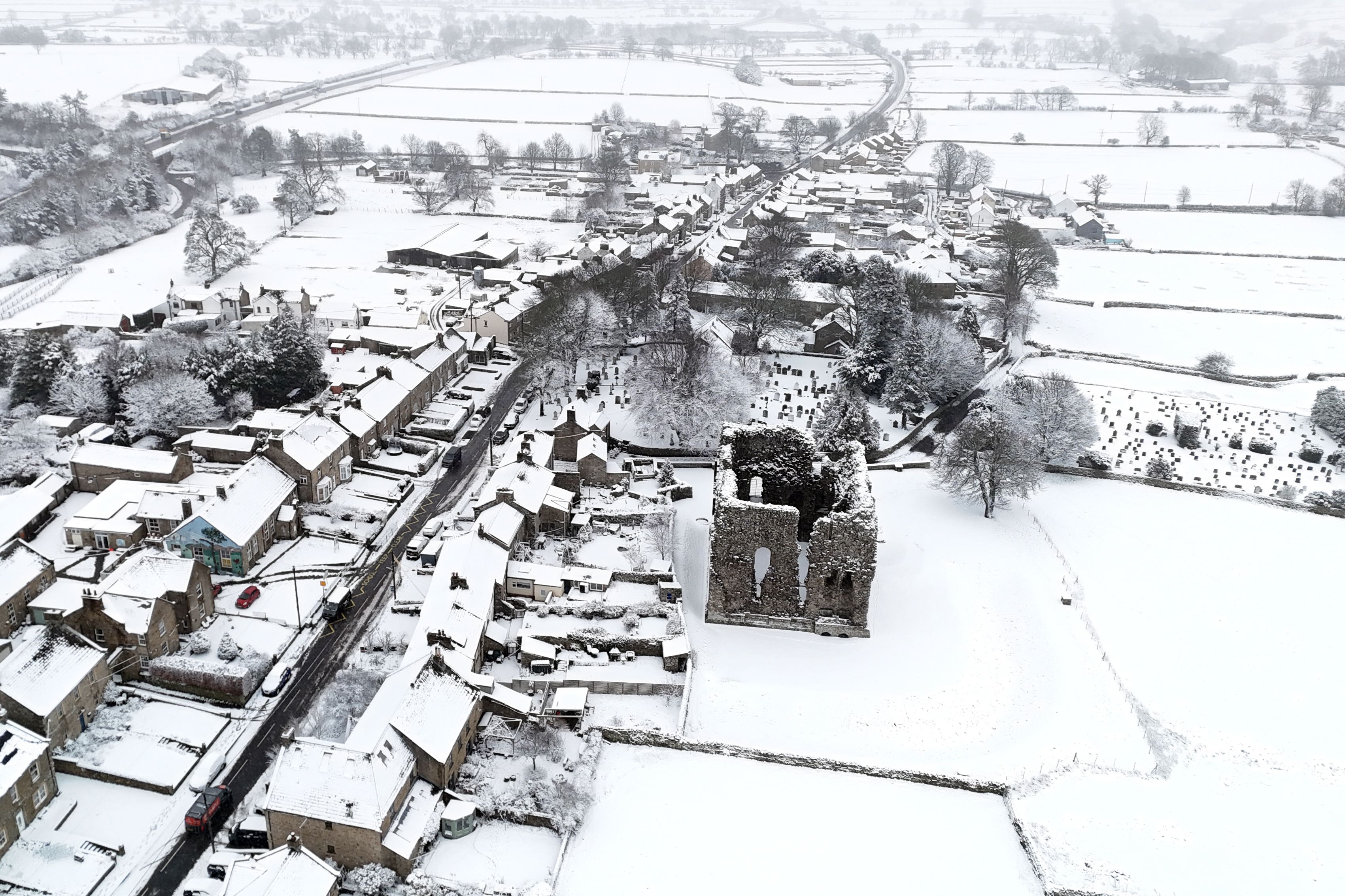 Yellow weather warnings for snow and ice remain in force across parts of the UK (Owen Humphreys/PA)