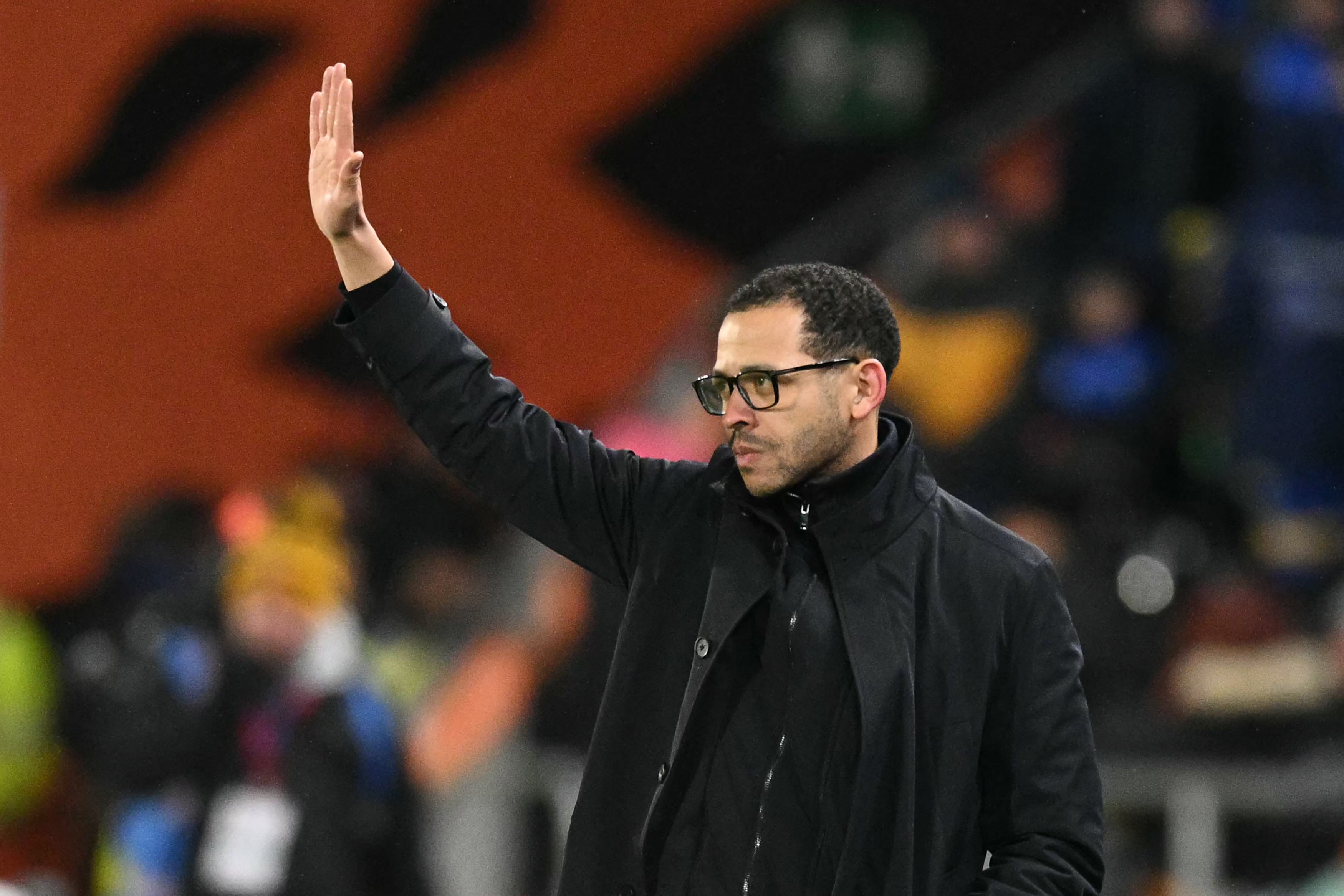 Chelsea's English head coach Liam Rosenior waves to the Hull fans on the touchline
