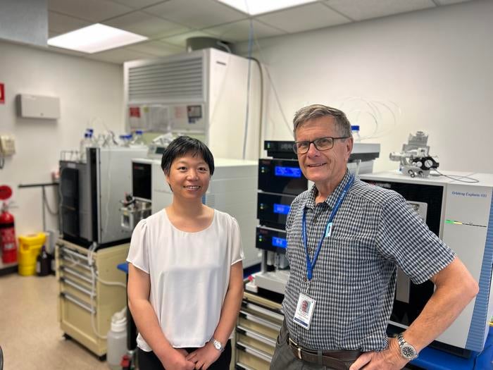 Flinders University’s Dr. Jing Jing Wang and Professor Tom Gordon pose in a lab in South Australia
