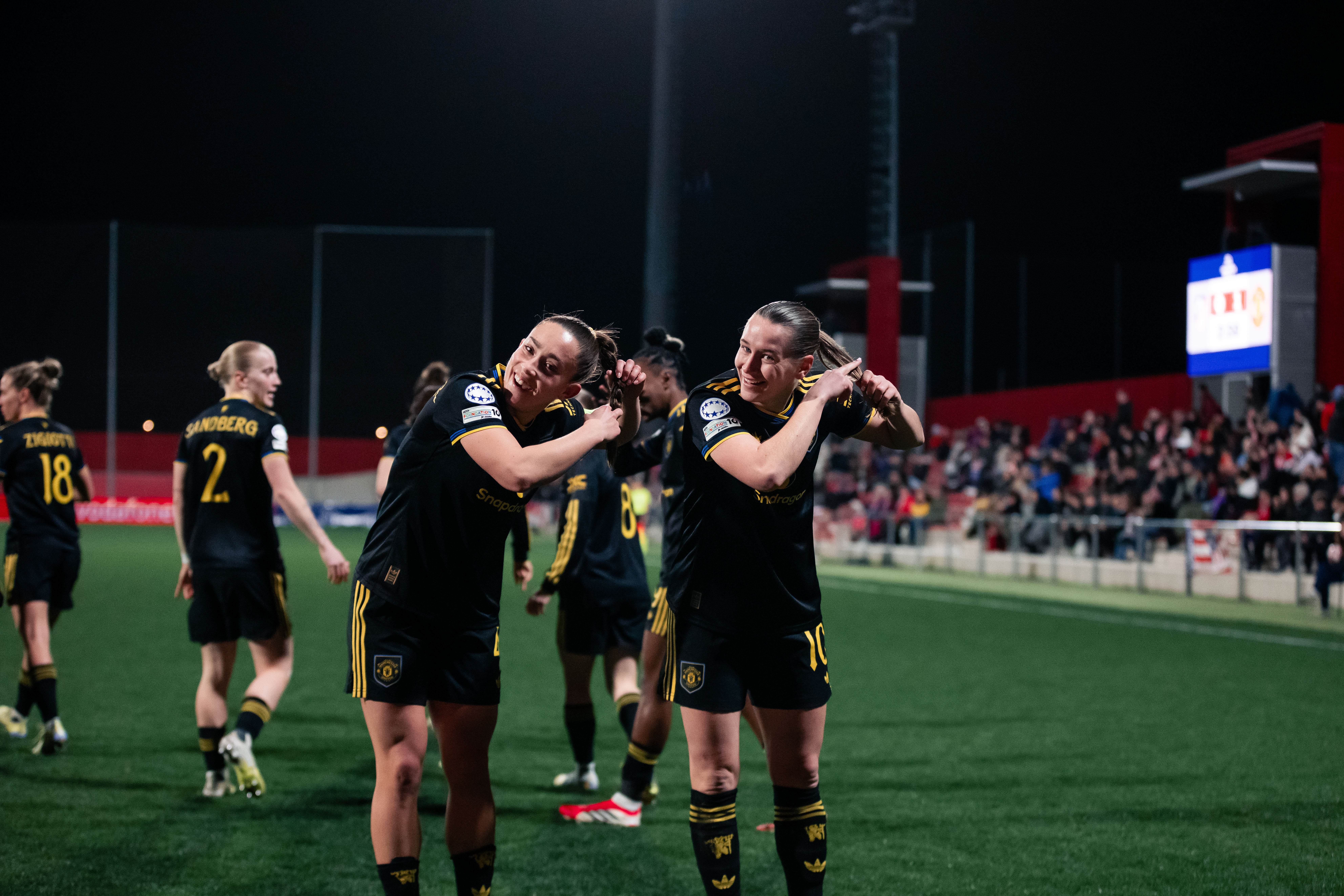 <p>Elisabeth Terland of Manchester United celebrates scoring her teams first goal with teammate Maya Le Tissier </p>