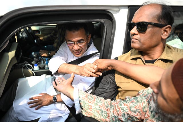<p>Bangladesh Nationalist Party (BNP) chairman and election candidate Tarique Rahman (L) greets his supporters as leaves his residence in Dhaka on 13 February 2026 a day after Bangladesh's general election</p>