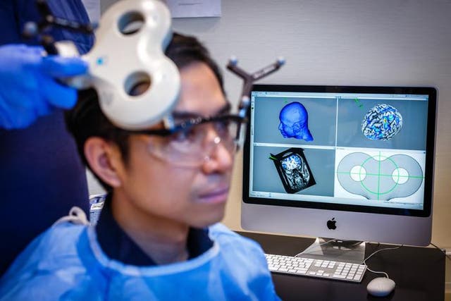 <p>A participant receiving non-invasive brain stimulation during an experiment in a laboratory setting</p>