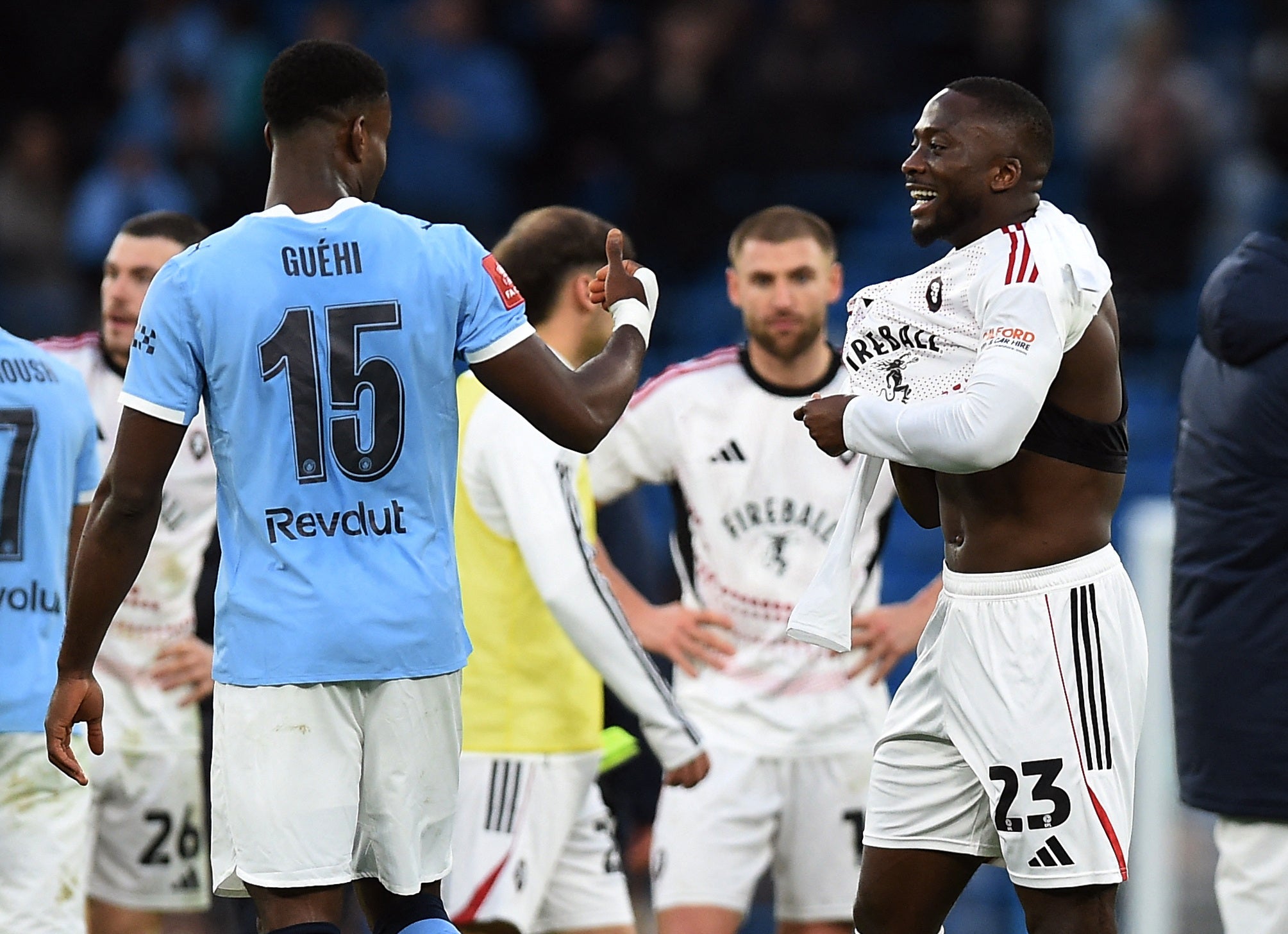 Marc Guehi with Salford City's Daniel Udoh after the match