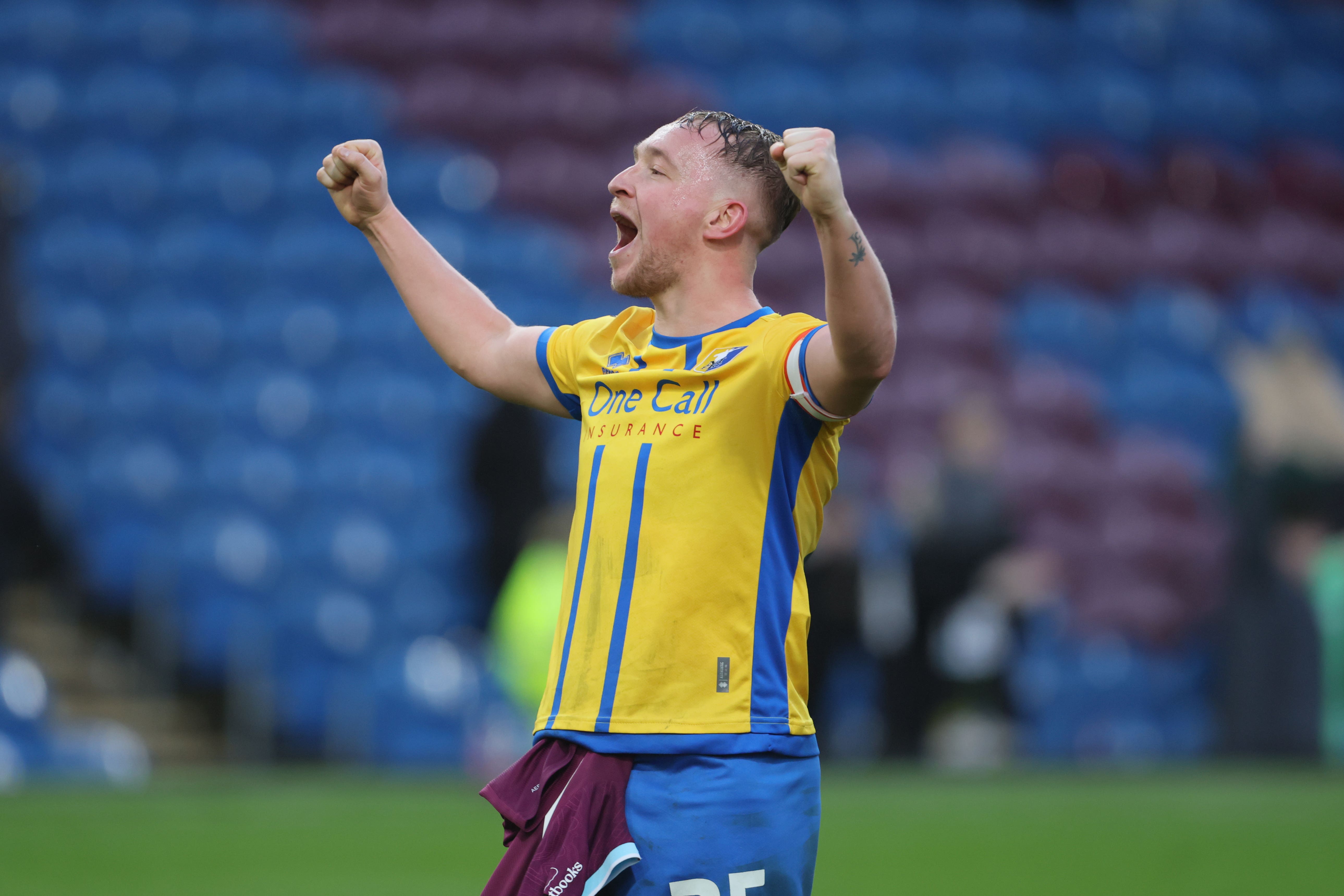 Louis Reed celebrates his winning goal against Burnley (Richard Sellers/PA)